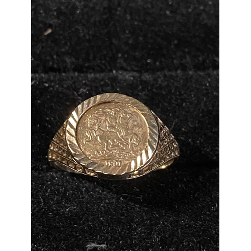 280 - A 9ct gold ring with yellow metal coin 1.51g