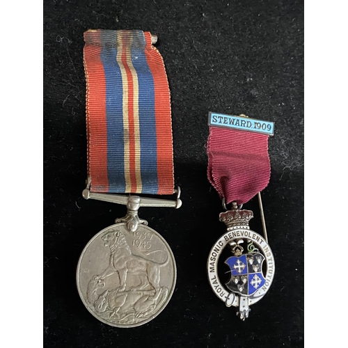 286 - A silver masonic medal and a WW2 medal