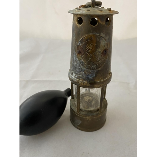 A miniature miners lamp and pressure balloon