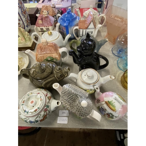 295 - A selection of assorted collectable teapots including Sadler