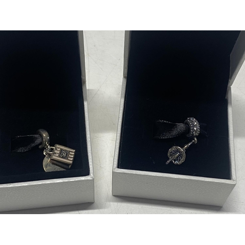 203 - Two boxed Pandora charms