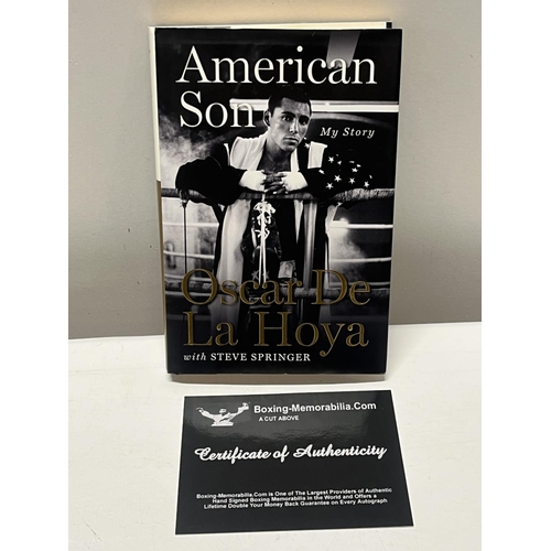 311 - A Oscar de la Hoya book signed with COA