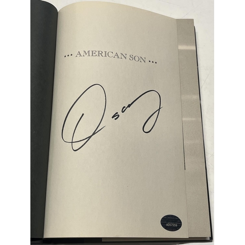 311 - A Oscar de la Hoya book signed with COA