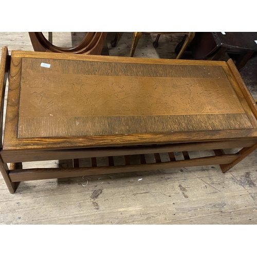 106 - A vintage mid century coffee table with an unusual copper insert to the top. 117cm x 50cm. No shippi... 