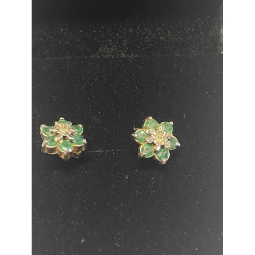 147 - A pair of 9ct  gold, emeralds & diamond earrings.