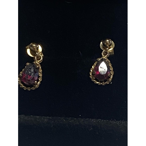 149 - A pair of 9ct  gold & red garnet drop earrings.