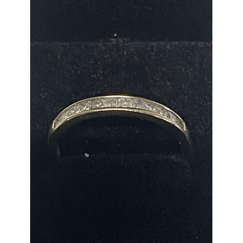 152 - A ladies 18ct white gold diamond set band ring. With Princess cut diamonds. Gross weight of ring 1.9... 