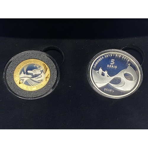 188 - A pair of cased silver proof coins celebrating the handover to Rio for the Olympic games