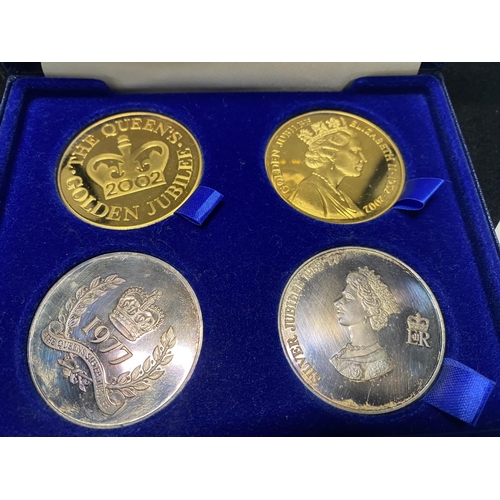 195 - A Sterling silver plated & gold plated four coin set & a 1983 UK UNC coin set.