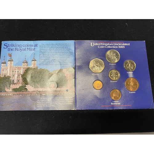 195 - A Sterling silver plated & gold plated four coin set & a 1983 UK UNC coin set.