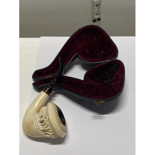 213 - A antique cased Meerschaum with a cherry amber mouth piece