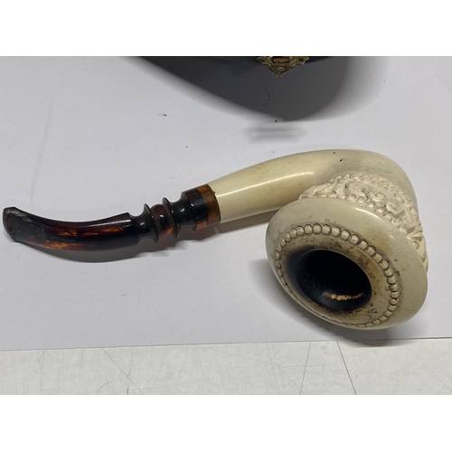 213 - A antique cased Meerschaum with a cherry amber mouth piece