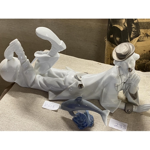 233 - A large Lladro clown figure40cm long and a small Lladro dolphin