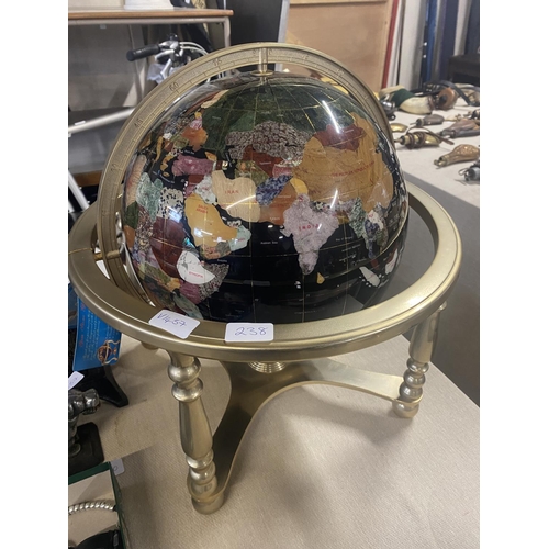 238 - A large Jem stone globe on a brass stand. Globe is 40cm in diameter. No shipping