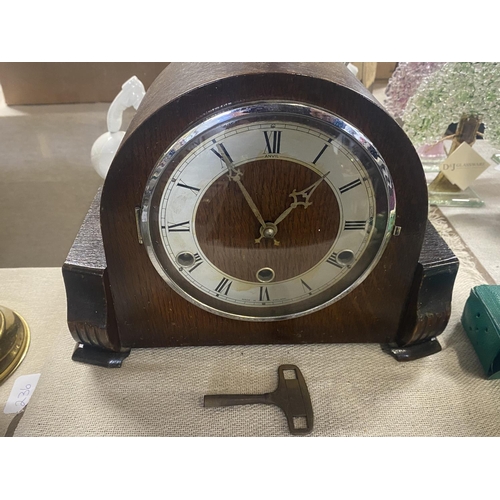 243 - A 1930's wooden cased mantle clock with key & pendulum.