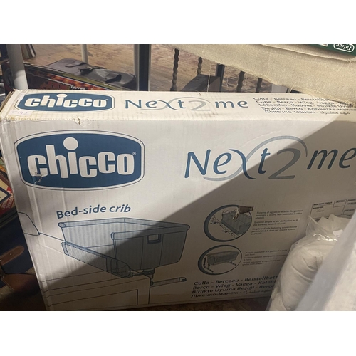 247 - A boxed Chicco bedside crib.  shipping unavailable