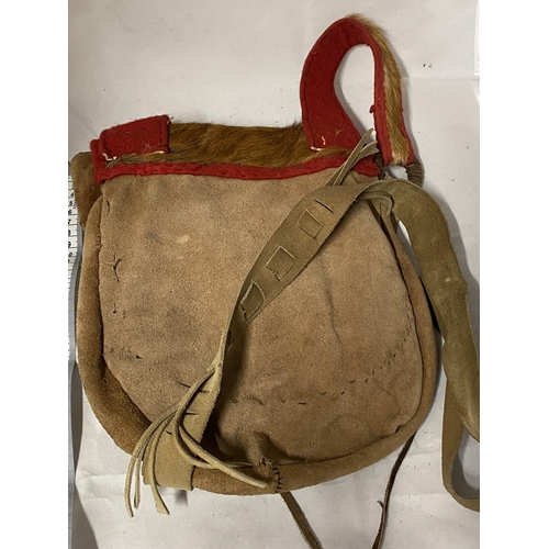 25 - A vintage native Indian style hand sewn hunting shoulder bag made from animal hide