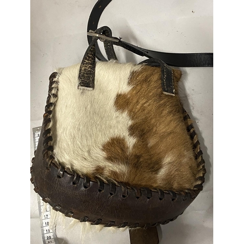 26 - A vintage native Indian style hand sewn hunting shoulder bag made from animal hide