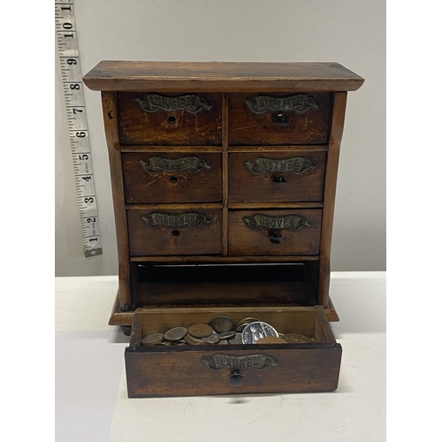 279 - An antique wooden spice cabinet. (some draw knobs missing) 23cm x 20cm