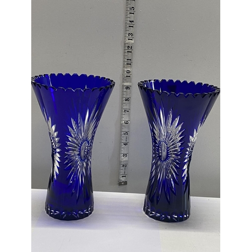 285 - A pair of Bristol blue Bohemian vases 25cm tall