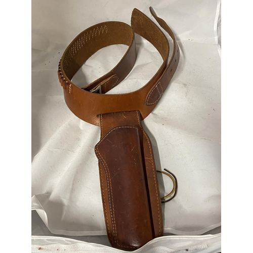 34 - A vintage leather pistol and cartridge belt