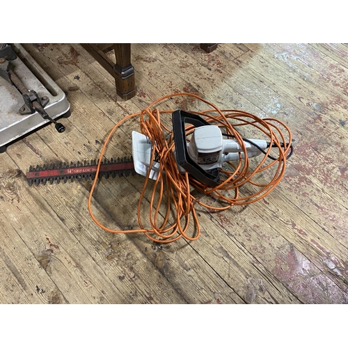 79 - An electric hedge trimmer in GWO.  shipping unavailable