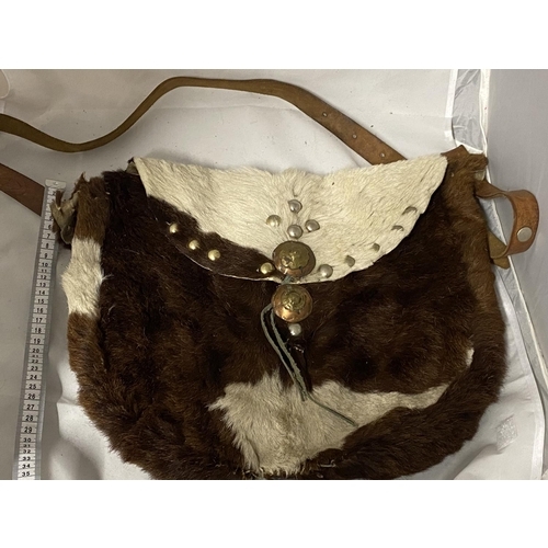 27 - A vintage native Indian style hand sewn hunting shoulder bag made from animal hide