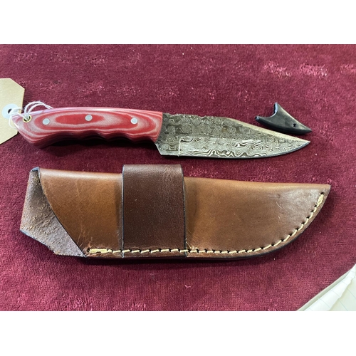 120 - A hand forged Damascus steel bladed knife in leather sheath, over 18's only, UK post only