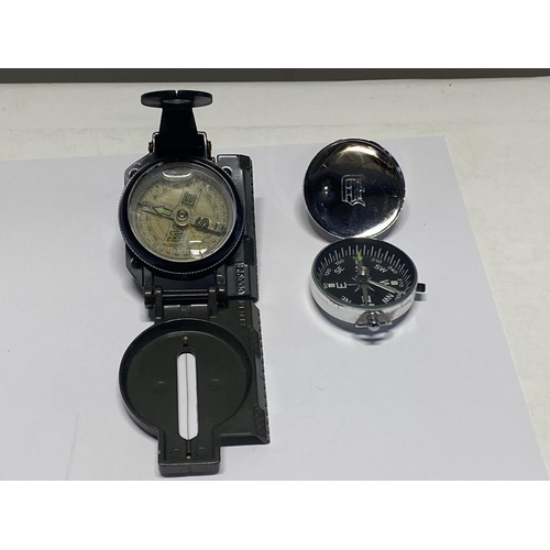 123 - Two military style compasses.