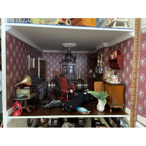 1 - A large vintage dolls house. complete with furniture for each room. 87x95x44cm .Shipping unavailable