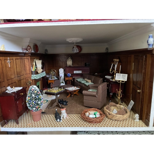 1 - A large vintage dolls house. complete with furniture for each room. 87x95x44cm .Shipping unavailable