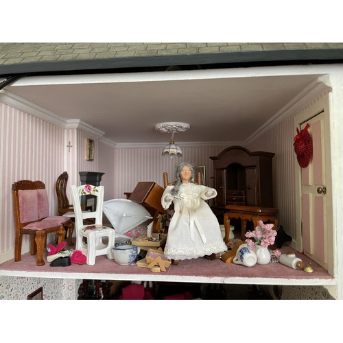 1 - A large vintage dolls house. complete with furniture for each room. 87x95x44cm .Shipping unavailable