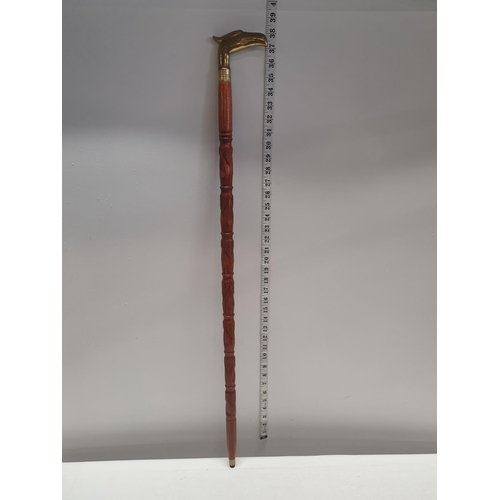 360 - A brass topped walking cane. Shipping unavailable