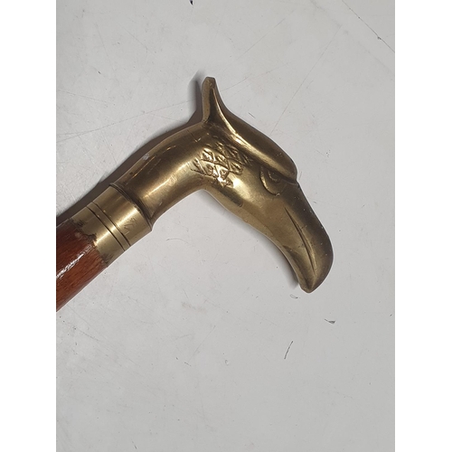 360 - A brass topped walking cane. Shipping unavailable