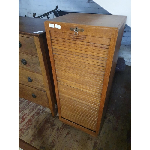 51 - An antique oak roll front Tambour cabinet with key, lock in working order. 115x48x38, shipping unava... 