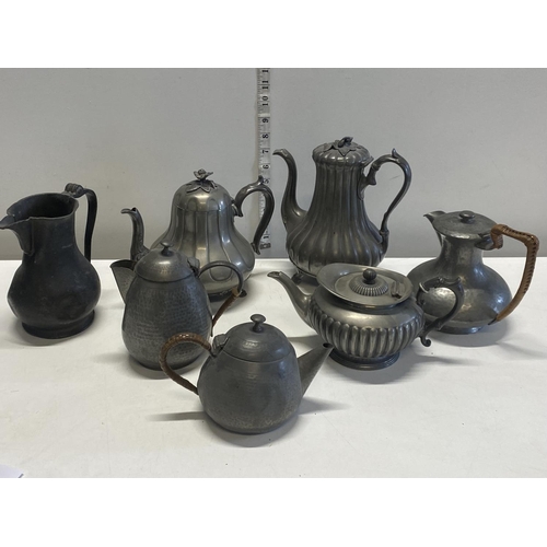 13 - A job lot of pewter teapots