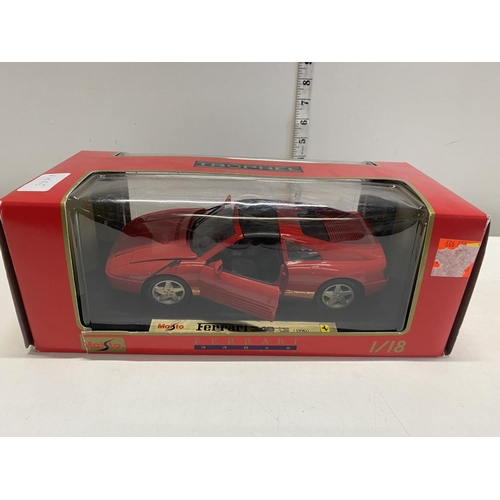 47 - A boxed tropee Ferrari die cast model