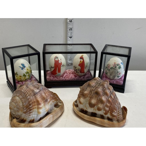 54 - Four cased oriental painted eggs and two shells.Shipping unavailable