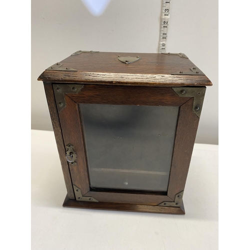 57 - A vintage smokers cabinet with key.Shipping unavailable