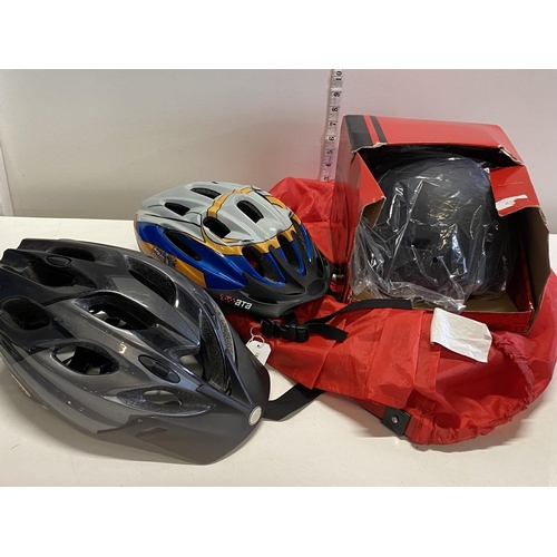 79 - Three new bike helmets.Shipping unavailable