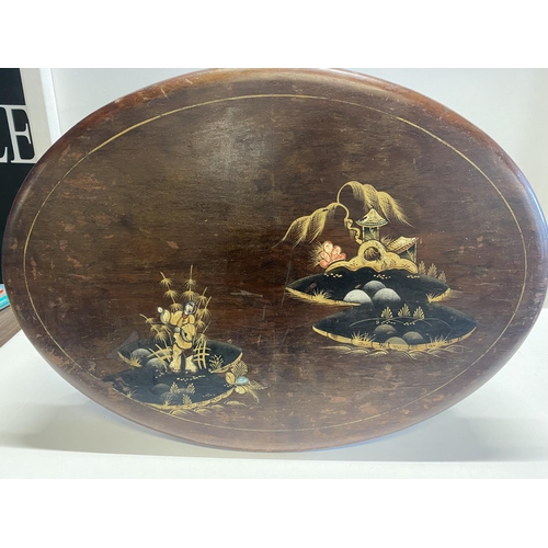 88 - A small antique occasional table with Oriental decoration 68cm long  x 50cm wide. No shipping