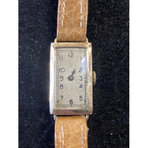 123 - A ladies Art deco period 9ct gold bodied Dennison case watch