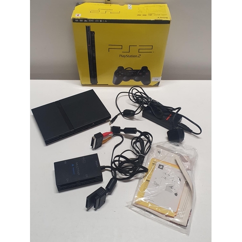 229 - A boxed PS2 and accessories (untested)