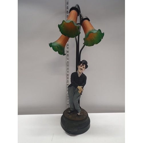 231 - A Charlie Chaplin themed table lamp signed Peter Mook, shipping unavailable