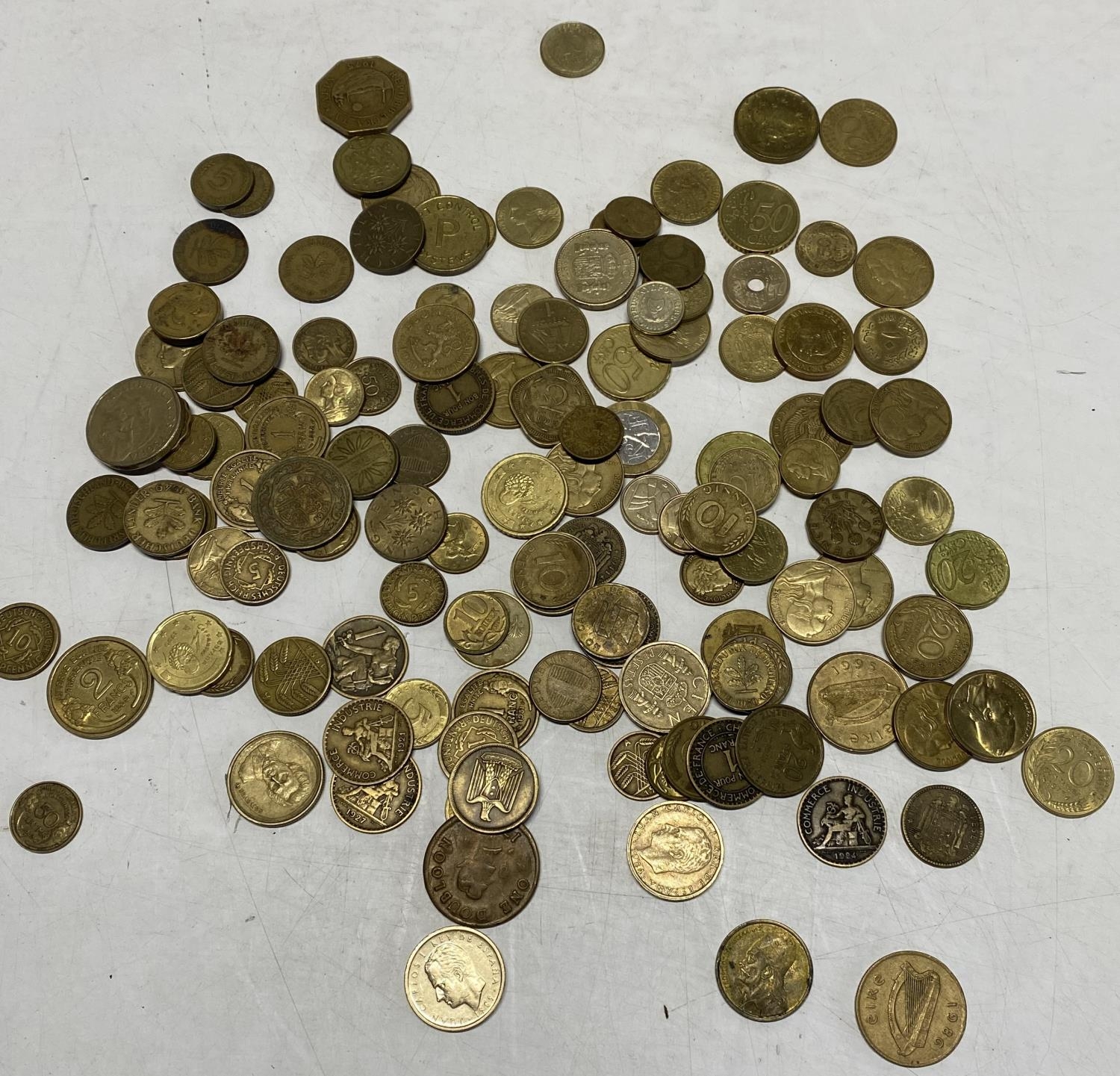 A box of foreign brass coins