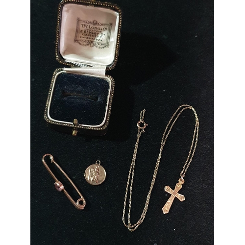 128 - Three pieces of 9ct gold including bar brooch, cross and chain and St. Christopher pendant, 4.30g