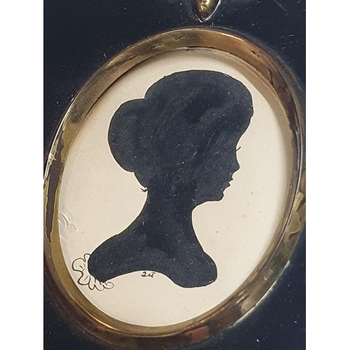 13 - A framed silhouette and a framed cameo