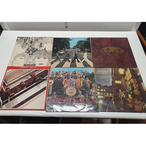 206 - A vintage LP record case and contents of mixed genre LP records including David Bowie, Beatles etc