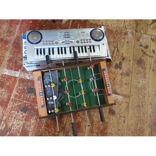 288 - A vintage table top football game and electronic keyboard, shipping unavailable