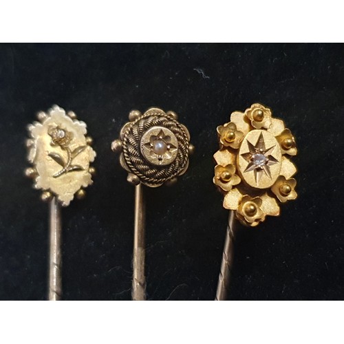 129 - Three stamped 15ct stick pins total weight 3.78g